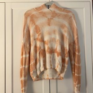 Orange and white tie dye sweater with hood.